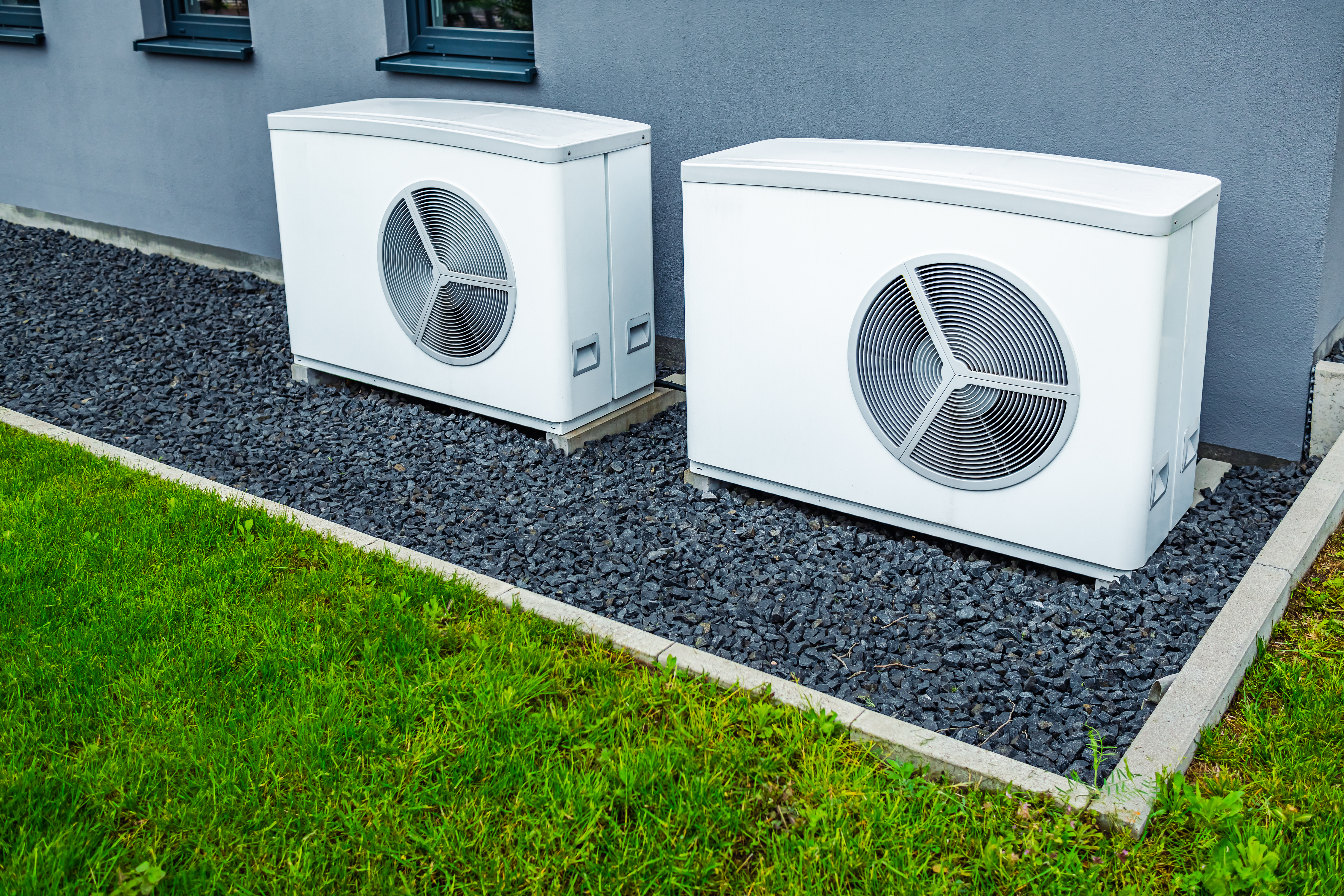 Energy specialist consulting with homeowner about heat pump installation