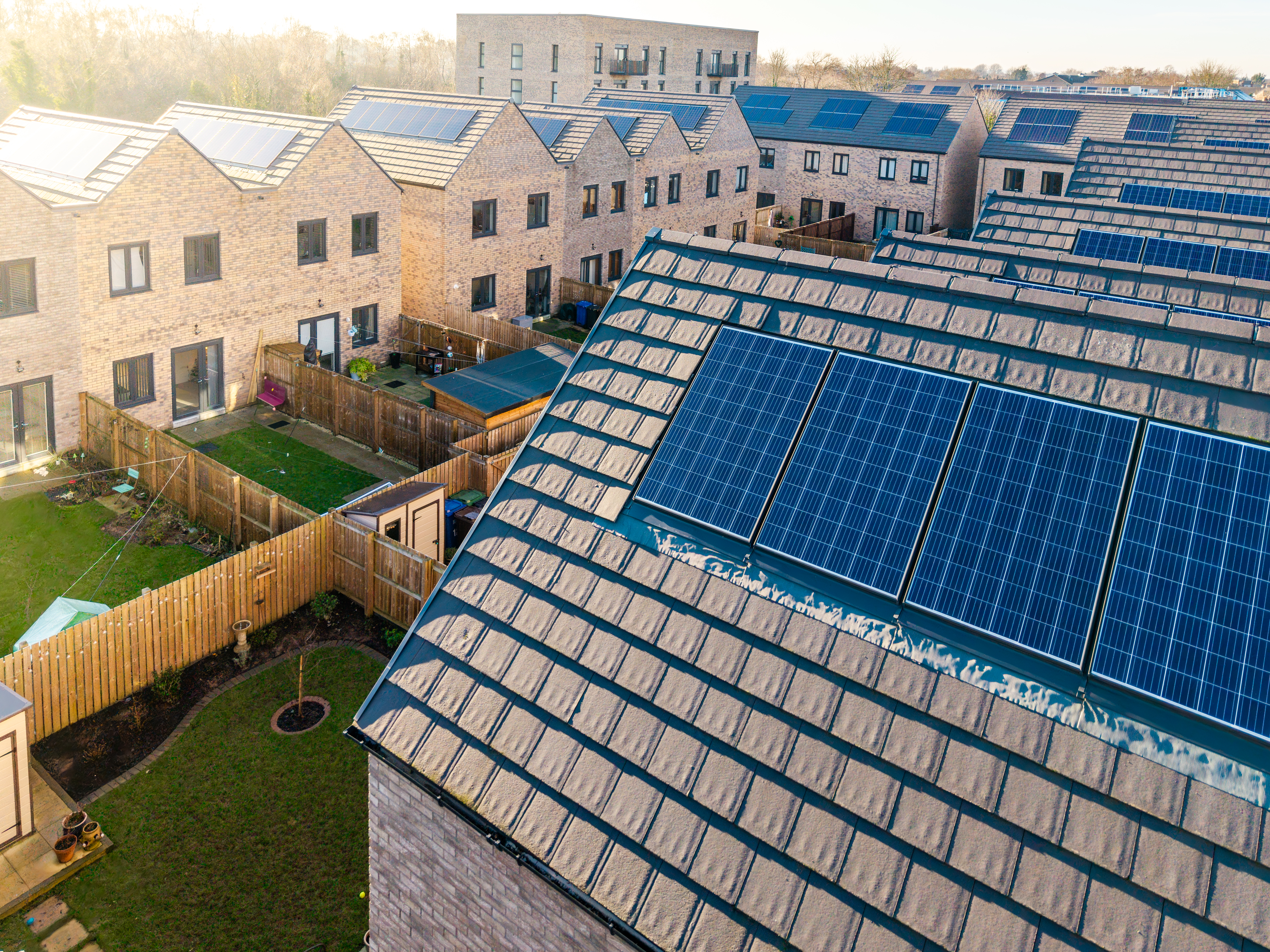 Row of houses with solar panels generating clean energy